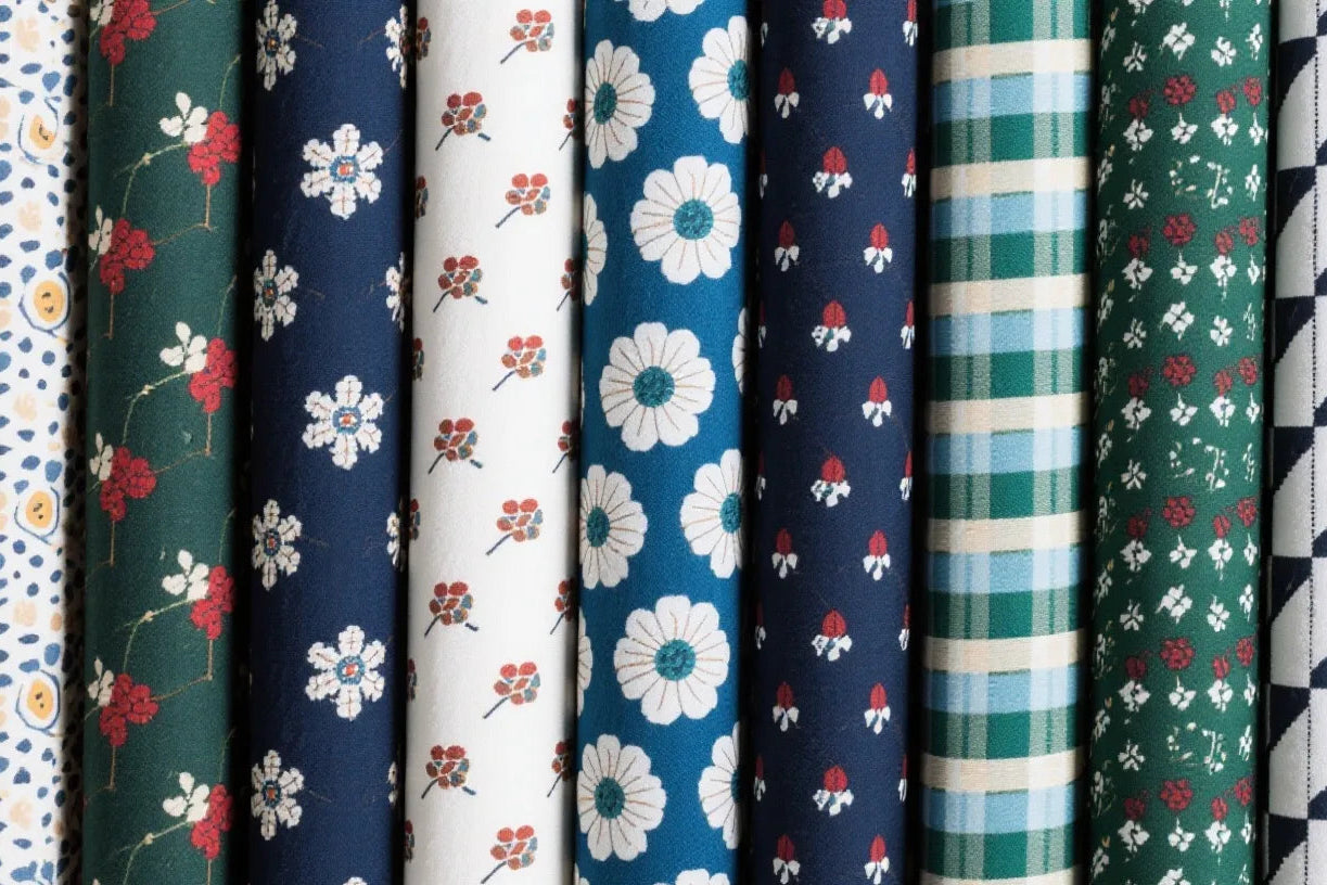 Collection of fabric swatches with various patterns and colors.
