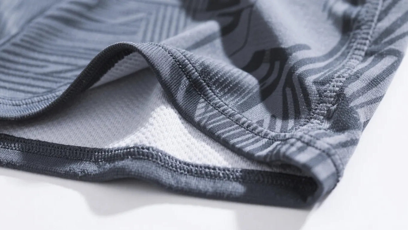 Moisture-wicking polyester sportswear, including golf polo shirts and base layers, and its breathable and quick-drying properties are crucial during summer tournaments